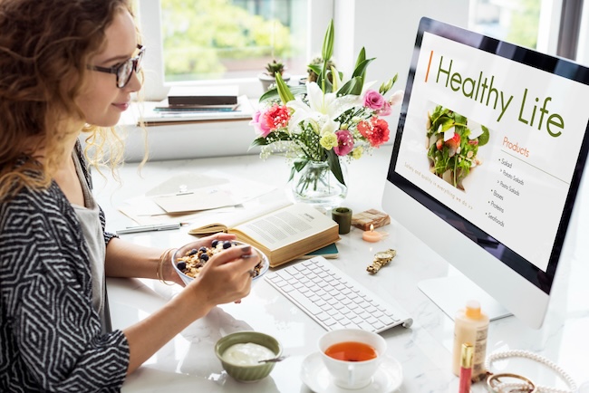 woman reading her healthy wellness plan